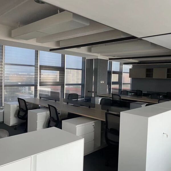 Office floor at Beijing Shiji Information Headquarters with roller shades along the windows