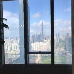 View from the Bank of Communications Shenzhen Headquarters through the window front to the skyline