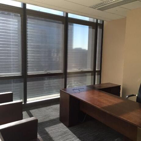 Office at the Asian Infrastructure Investment Bank after the installation, with lowered RHODESHADE roller shades