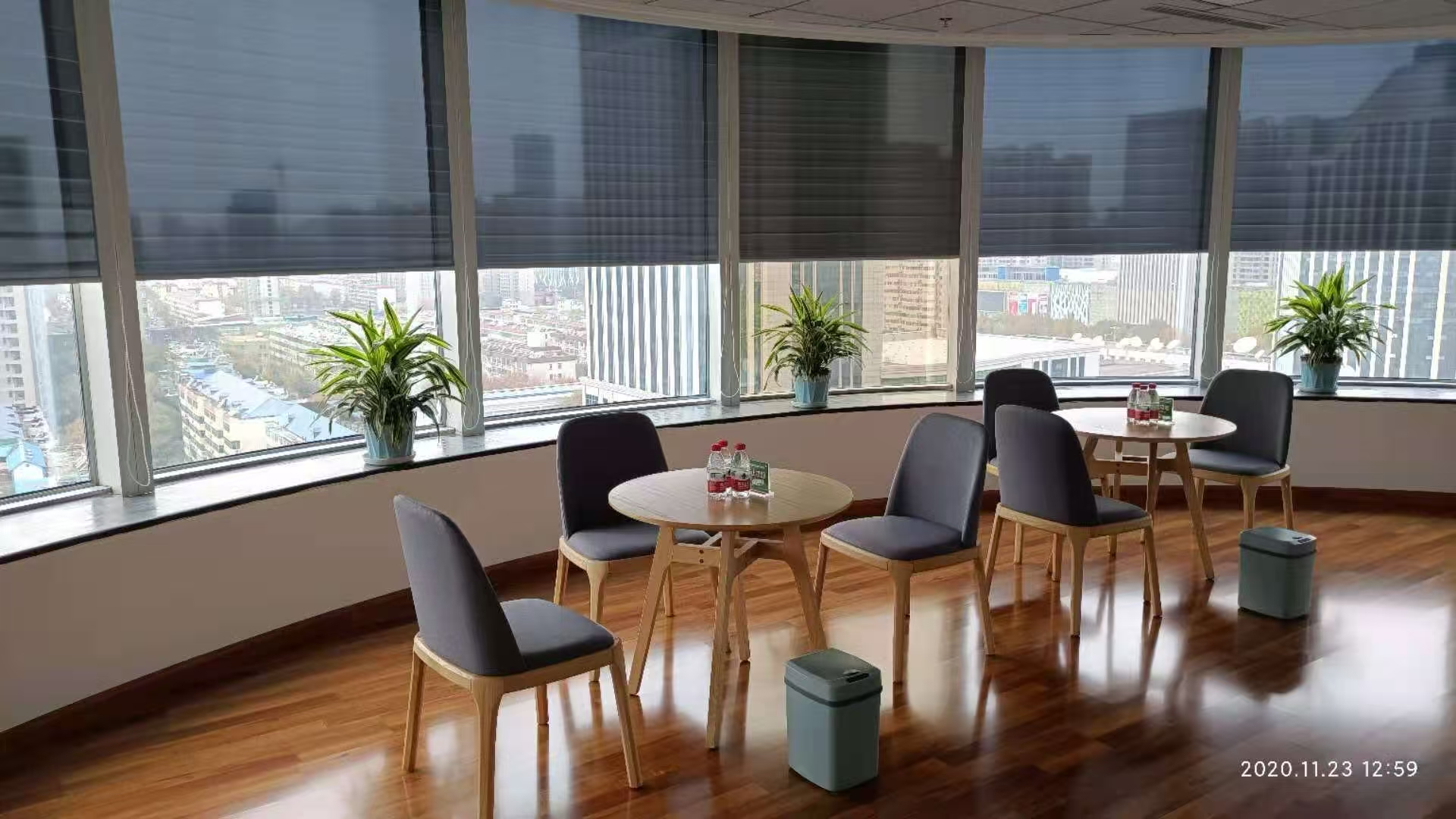 Meeting area at Hebei Electric Power Company with roller shades along the window front